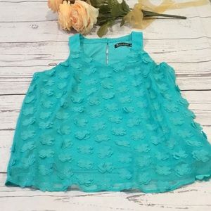 New York & Co teal blouse with appliqué flowers.